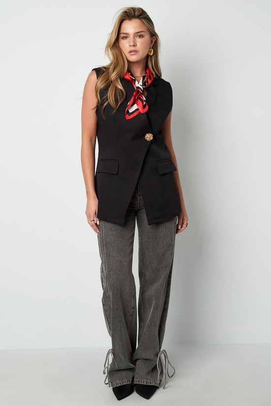 De mouwloze blazer